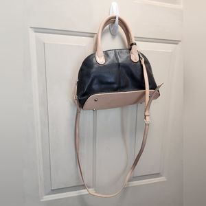 Tignanello leather purse with shoulder strap in black with tan accents.